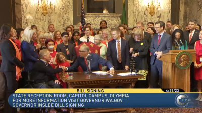 Jay Inslee shakes the hand of a participant at the signing of HB 1240 to ban assault weapon sales in Washington Jay Inslee shakes the hand of a participant at the signing of HB 1240 to ban assault weapon sales in Washington